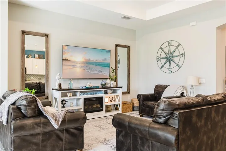 Living area with a glass covered fireplace