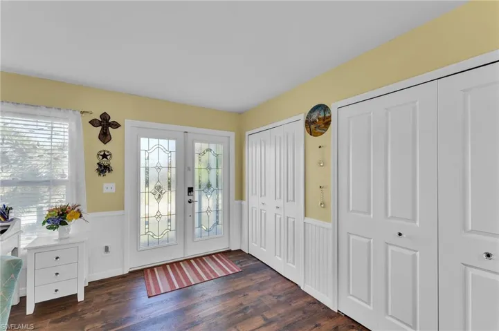 Foyer with dark hardwood / wood-style floors