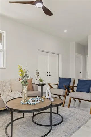 Living room featuring ceiling fan
