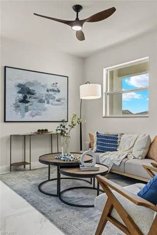 Living room featuring ceiling fan