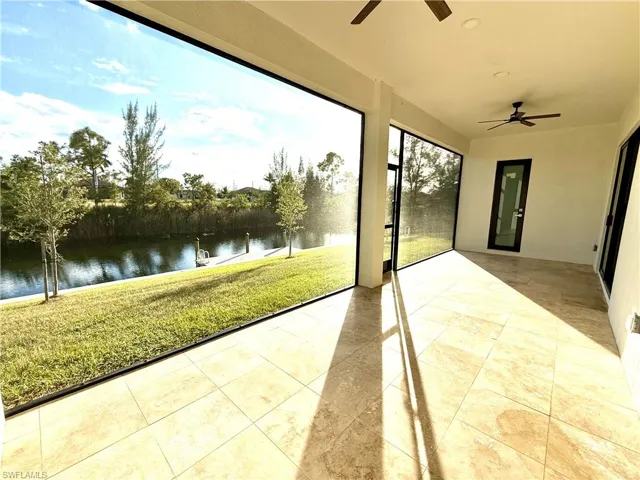 Sunroom featuring a water view with screen.