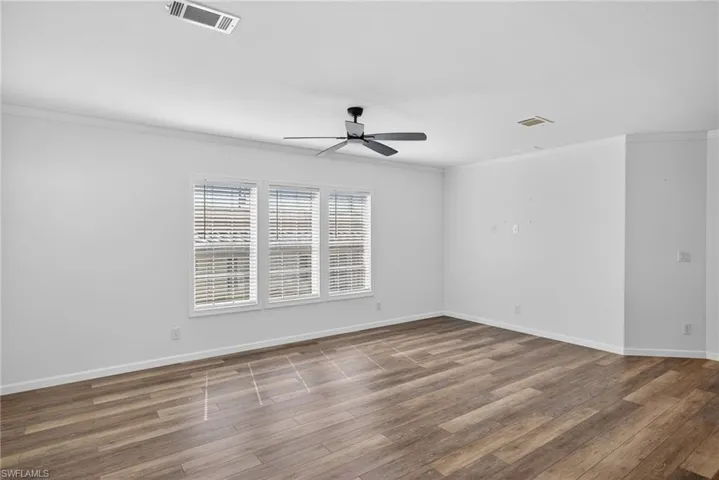 Living Room with ceiling fan and LVP flooring