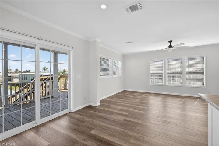 View from Dining area into the Living Room and sliding glass doors to front porch