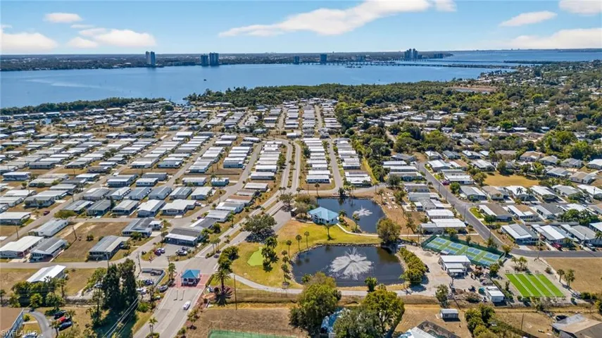 Aerial view of residential area with a nearby Caloosahatchee River and view of Downtown Fort Myers