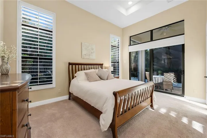 Spacious Primary Bedroom opens onto the screened lania.