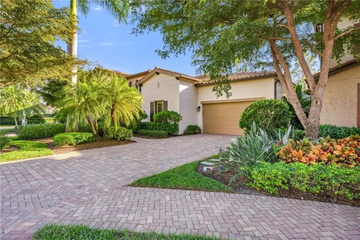 Beautiful landscaping surrounds the home.
