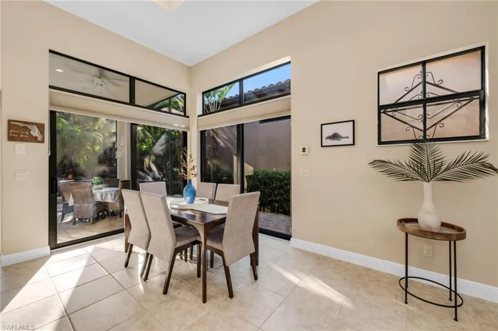 Dining area opens onto the screened lanai.
