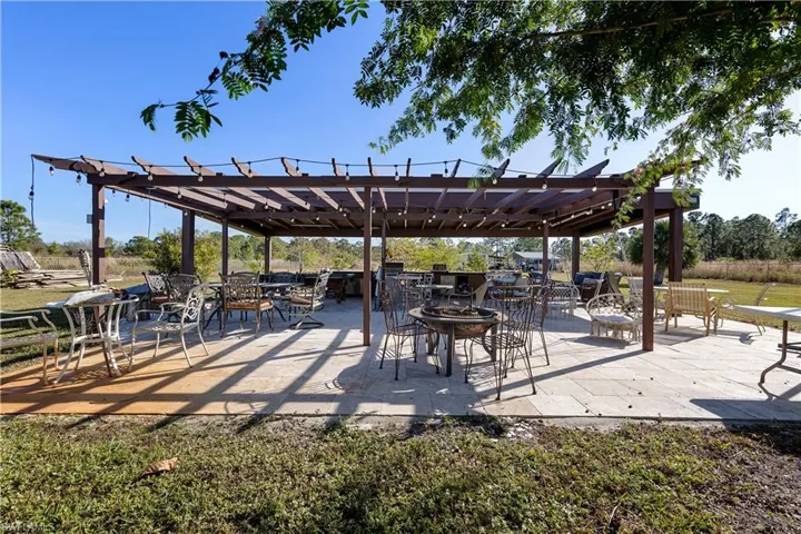 View of community with a patio area and a pergola
