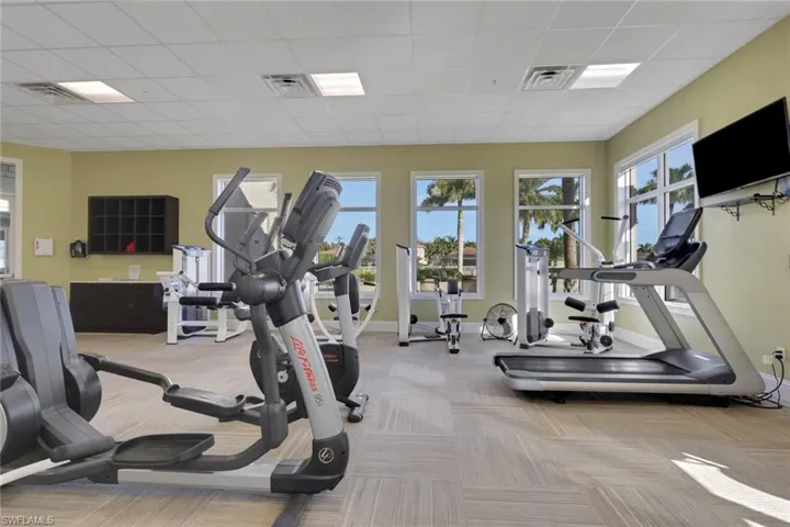 Workout area with a paneled ceiling
