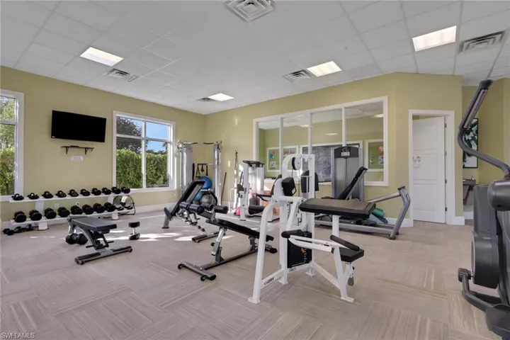 Workout area with a paneled ceiling