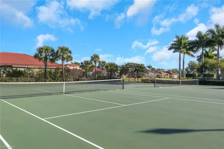 View of tennis court with community basketball court