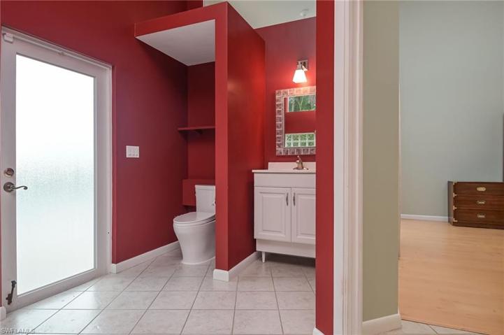 Primary bathroom with exit to the pool/outdoor shower