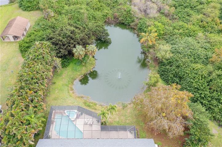 Large private lake with mature landscaping