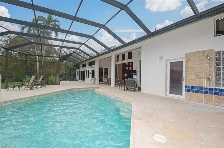 Outdoor shower, bathroom off the pool, and covered lanai space