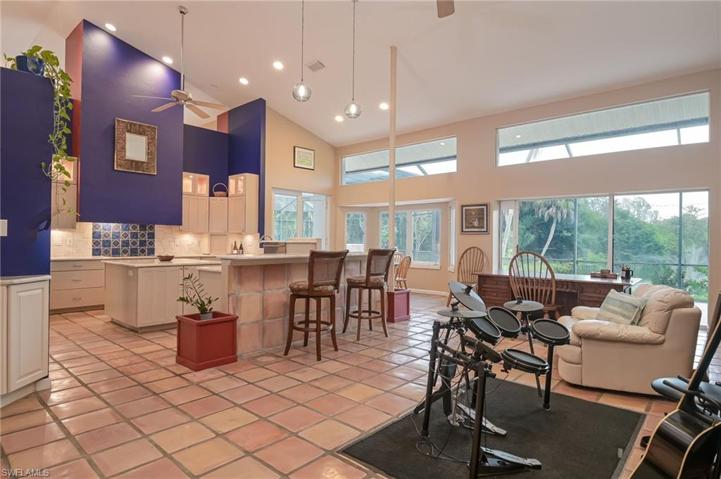 Used as an open office/hang out area currently with musical instrument, books, and two large desks - this is a large open area for that separates the primary bedroom from the other rooms