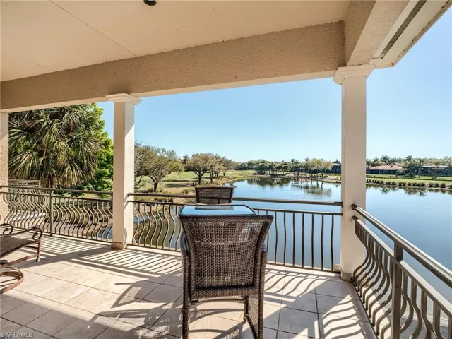 Balcony featuring a water view and 6th and 7th North course greens and fairways