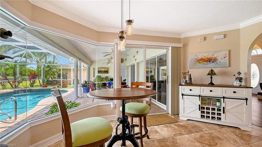 Dining area featuring ornamental molding