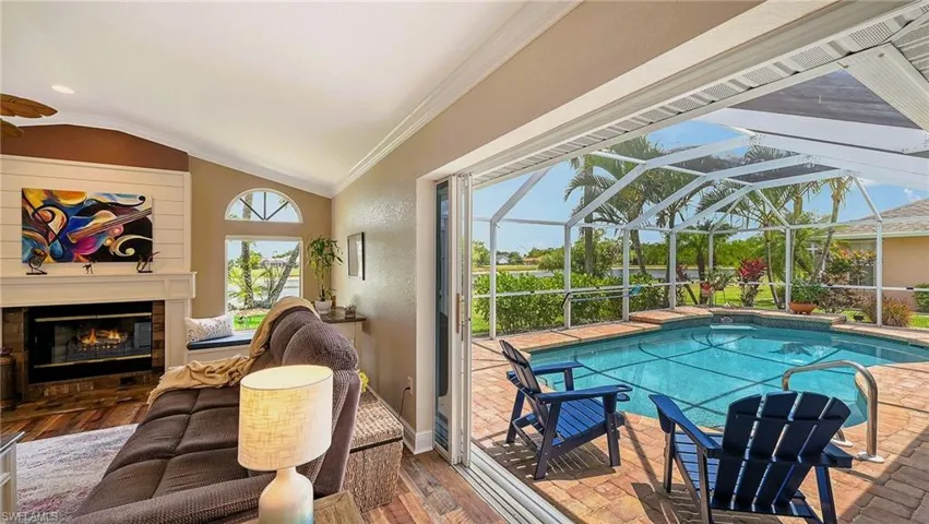 Outdoor pool featuring a glass covered fireplace