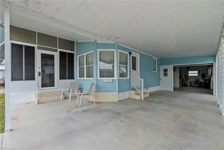 View of patio with a carport