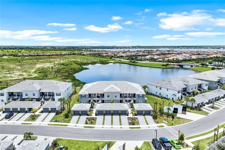 Aerial perspective of suburban area with a large body of water