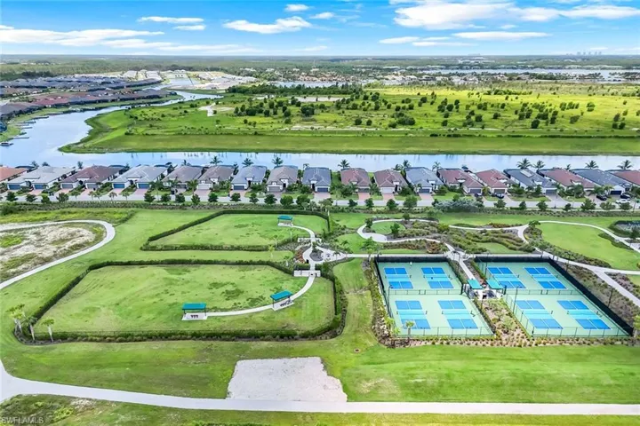 Aerial view of residential area featuring a large body of water