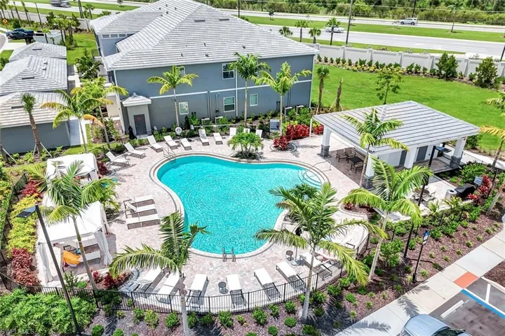 Community pool featuring a patio