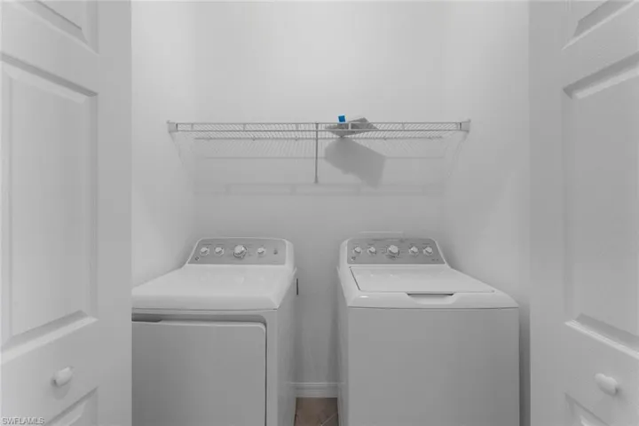 Laundry room featuring separate washer and dryer