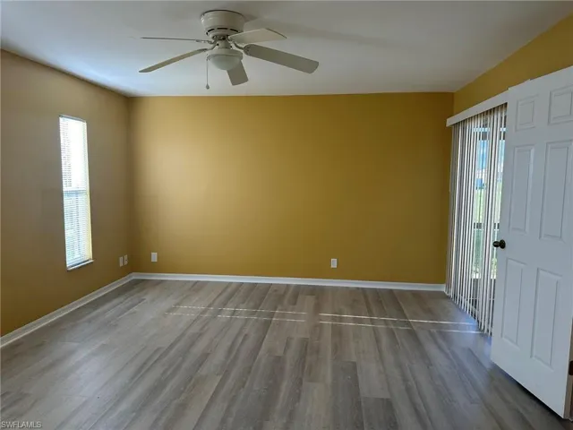 Unfurnished room with light wood-style flooring and ceiling fan