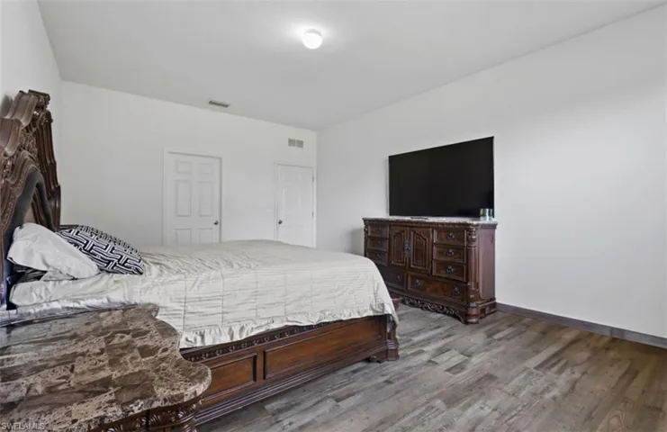 Bedroom featuring wood-type flooring