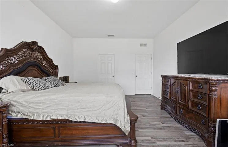 Bedroom featuring hardwood / wood-style flooring