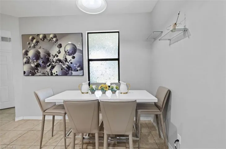 Dining space with light tile floors