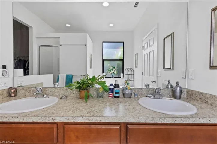 Bathroom featuring dual bowl vanity