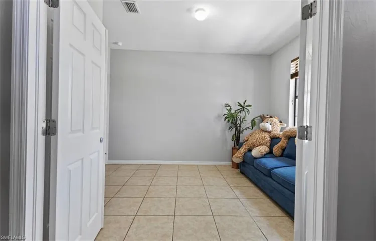Sitting room with light tile floors