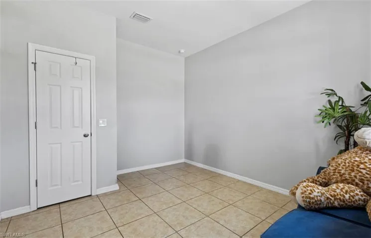 Living area with light tile floors