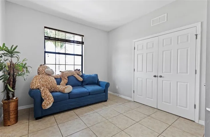 Sitting room with light tile floors