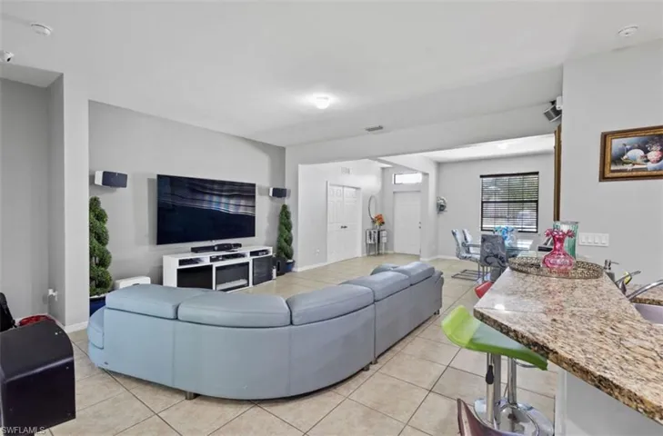 Tiled living room with sink