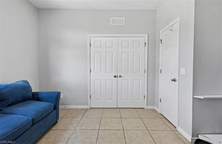 Living area with light tile floors
