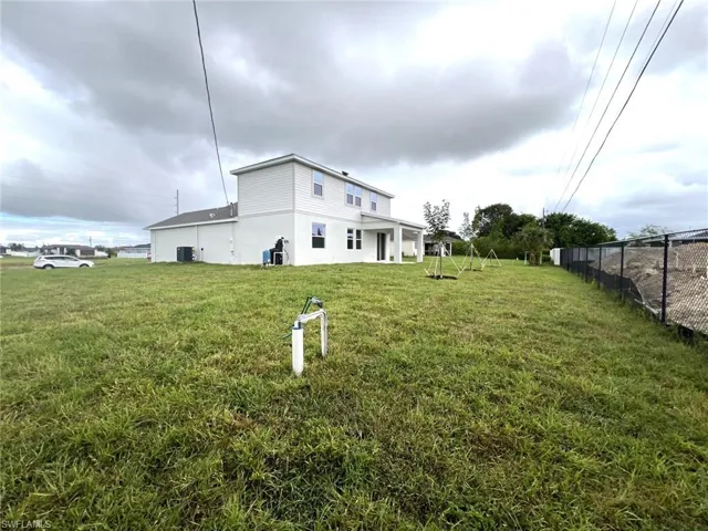 Rear view of house featuring a patio area