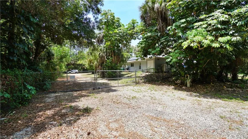 View of yard featuring a gate