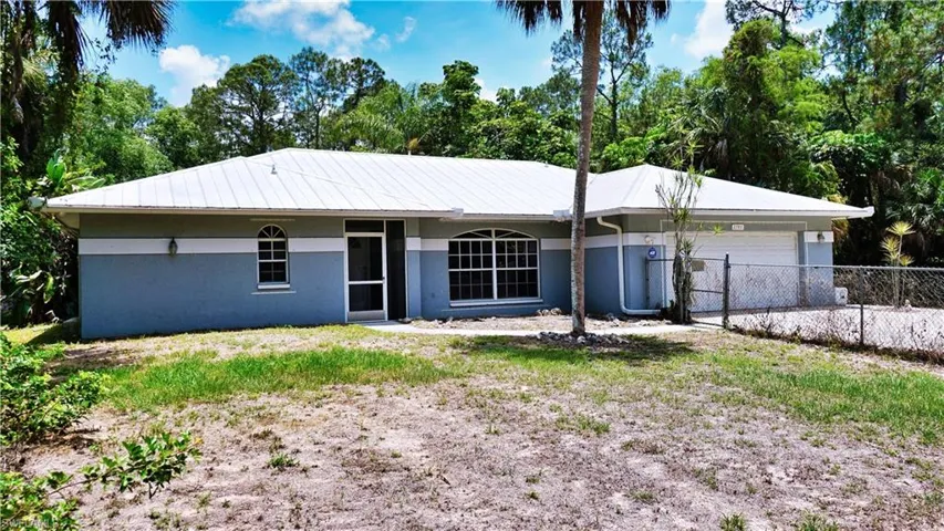 Ranch-style house with an attached garage and stucco siding