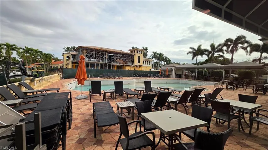 View of patio / terrace with a community pool and a gazebo
