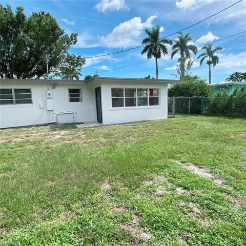 Rear view of house with stucco siding