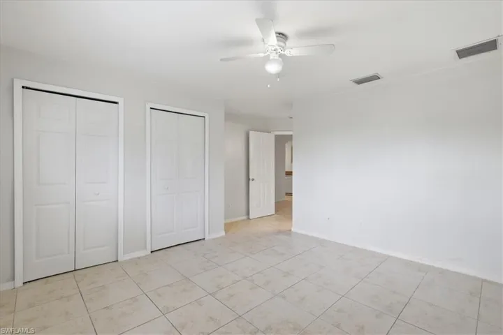 Neutral-toned tile flooring throughout