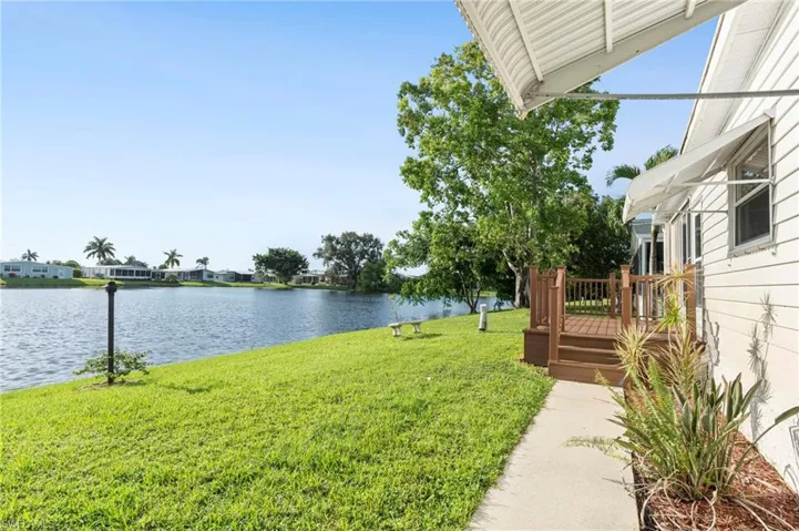 View of yard with a water view