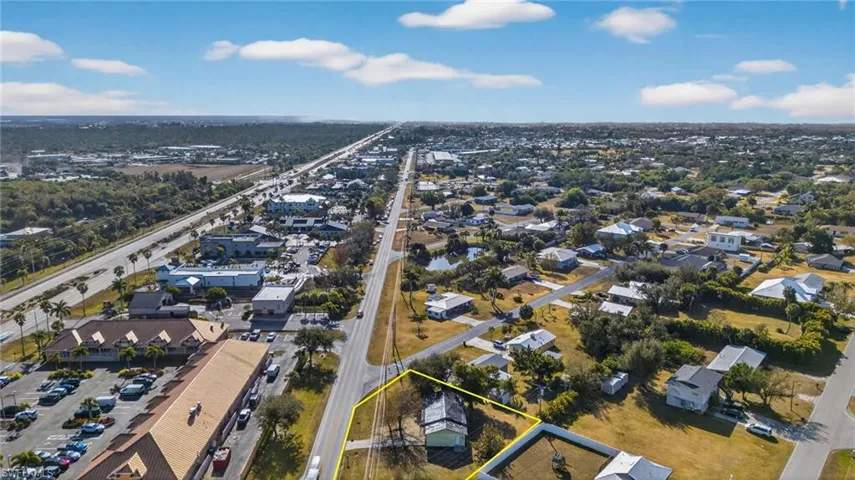 Aerial view of residential area with property parcel outlined