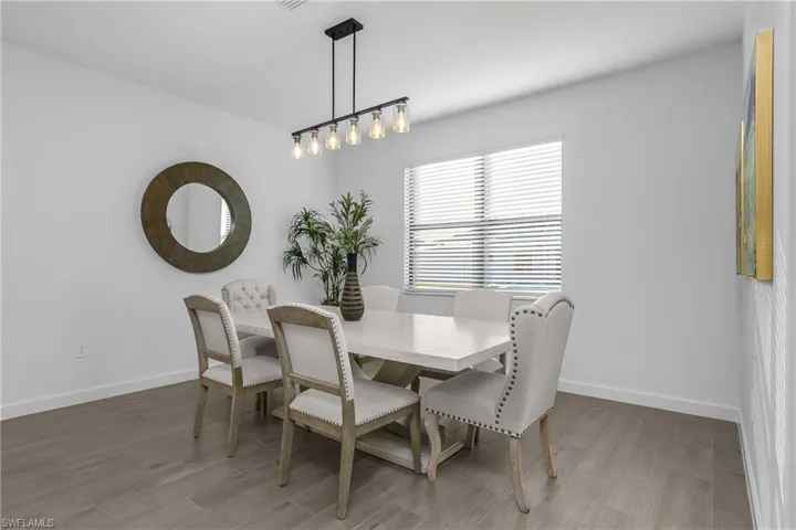 Enjoy family dining in this open floor plan. (Photo from nearby staged home)