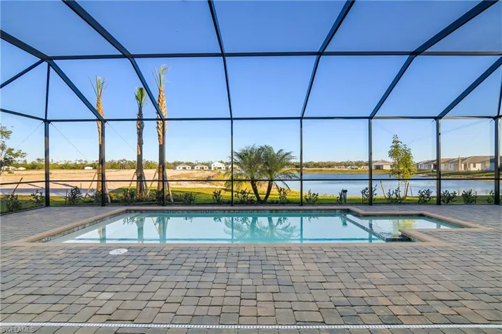 Gorgeous pool and spa with water views beyond.