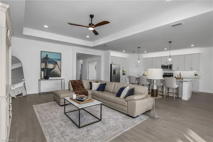 Spacious Great room and open floor plan makes this home perfect for entertaining. (Photo from nearby staged home)
