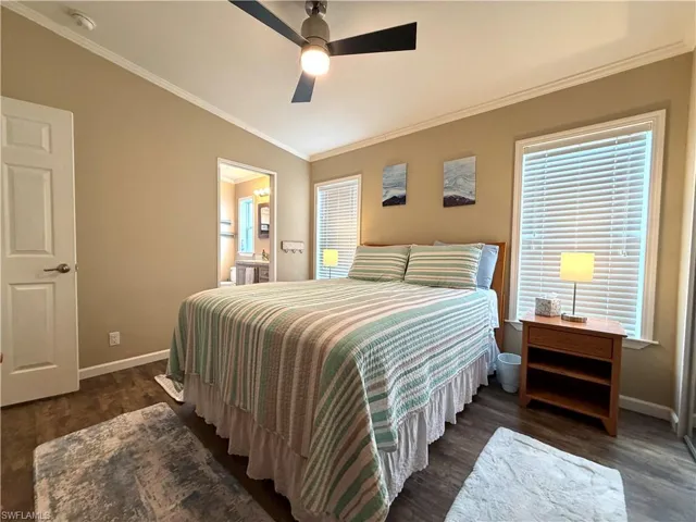 Wood-finish flooring, ceiling fan, and crown molding