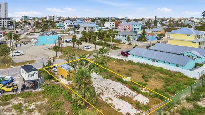 View of urban area featuring property parcel outlined and nearby suburban area